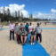 Group photo, including wheelchair users at the beach