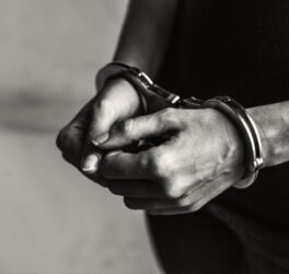 Person in handcuffs