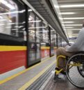 side view of a man in wheelchair at the station