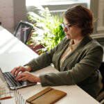 Woman in wheelchair working on laptop