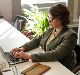 Woman in wheelchair working on laptop