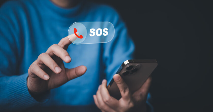 Man touch mobile phone for emergency call.
