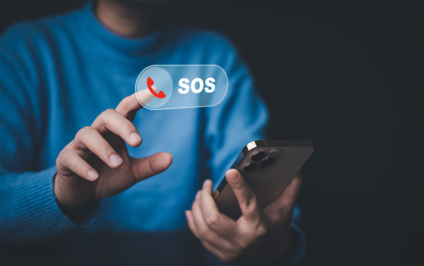 Man touch mobile phone for emergency call.