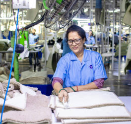 Woman Working in Textile Factory Smiling