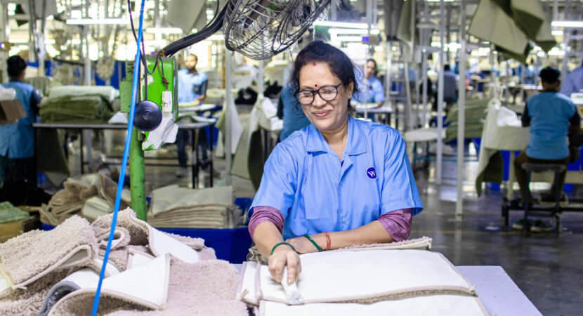 Woman Working in Textile Factory Smiling