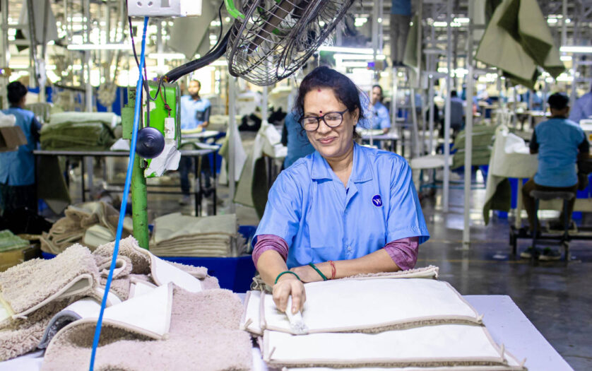 Woman Working in Textile Factory Smiling