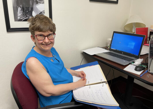 Lindsay Kondis working in the office