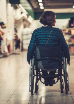 woman in wheelchair inside shopping mall