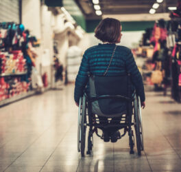 woman in wheelchair inside shopping mall