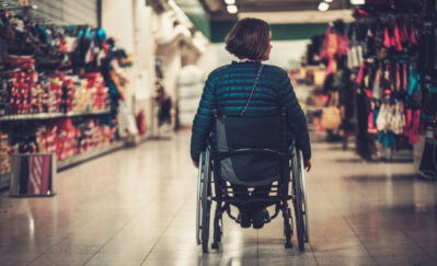 woman in wheelchair inside shopping mall