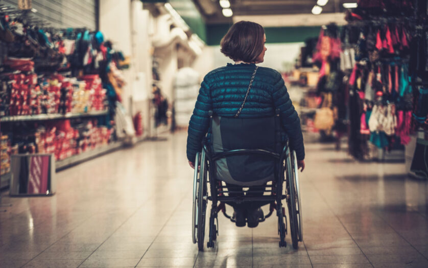 woman in wheelchair inside shopping mall