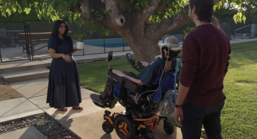 A person controlling their wheelchair using an Apple Vision Pro