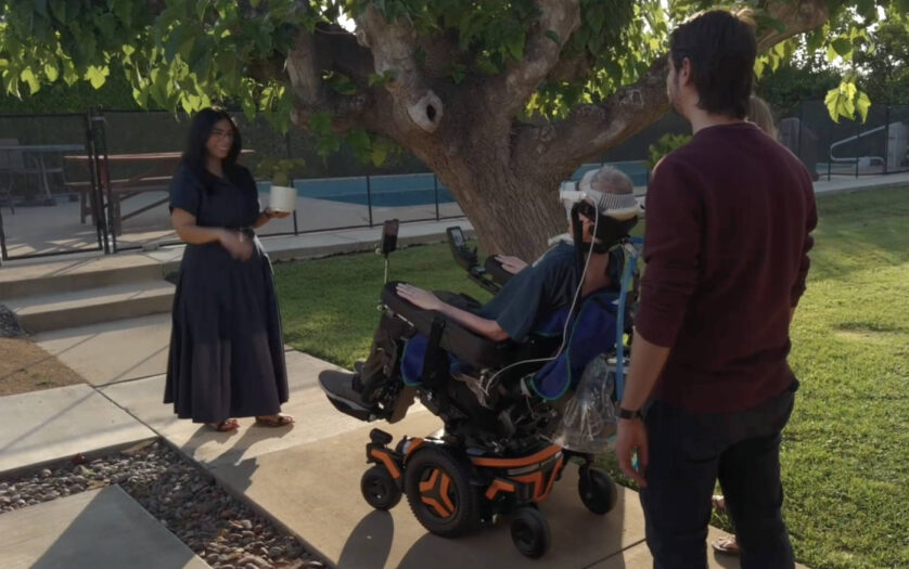 A person controlling their wheelchair using an Apple Vision Pro