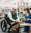 Person in wheelchair talking with staff