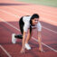 disabled athlete woman with prosthetic leg doing stretching exercises while sitting