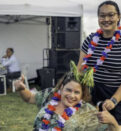 Woman in wheelchair celebrating Australia Day with her carer