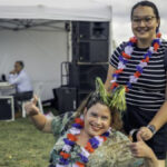 Woman in wheelchair celebrating Australia Day with her carer