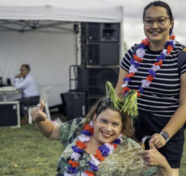Woman in wheelchair celebrating Australia Day with her carer