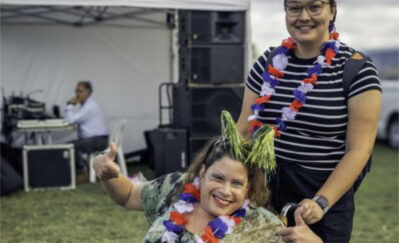 Woman in wheelchair celebrating Australia Day with her carer