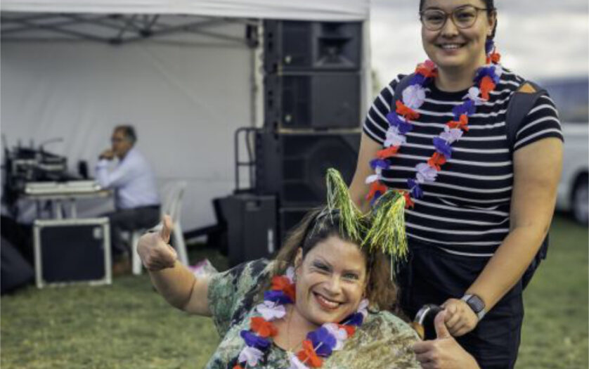 Woman in wheelchair celebrating Australia Day with her carer