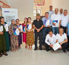 Training participants gathered for a group photo inside the Department of Education building, Darvoz, 29 July 2026