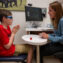 A neuropsychologist works with a child with autism.