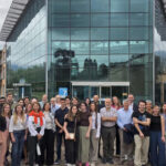 consortium team in front of the building
