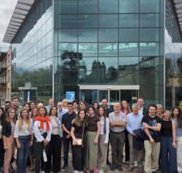 consortium team in front of the building