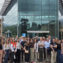 consortium team in front of the building