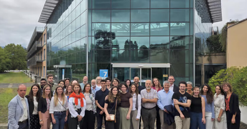 consortium team in front of the building