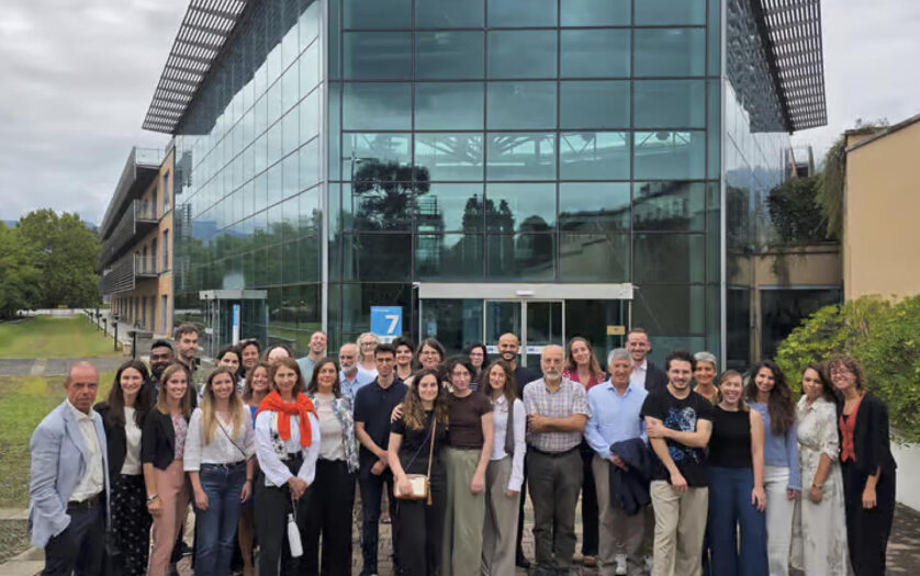 consortium team in front of the building