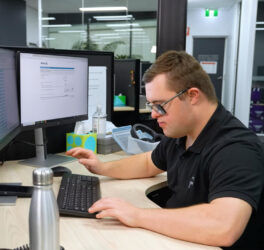 Jack Williamson working in the office