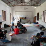 children sitting on the floor of safe spaces in Bidur 8, Nepal
